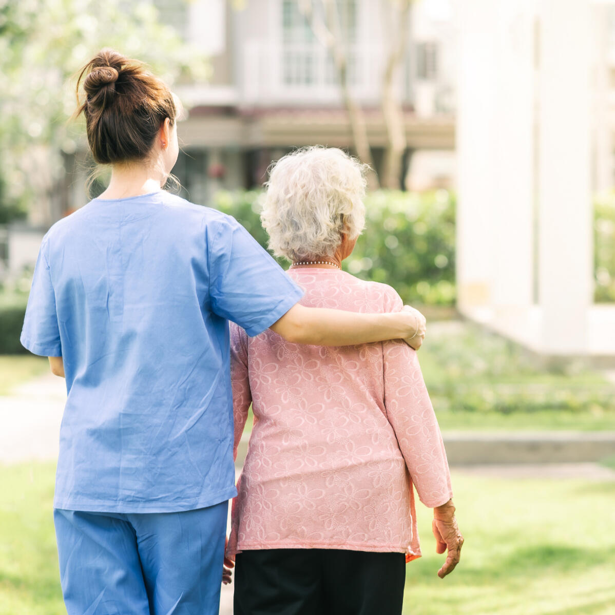 End-of-life planning in Ontario End-of-life planning in Ontario - backside of two individuals, one appearing to be a caregiver, with their arm wrapped around the other individuals back.
